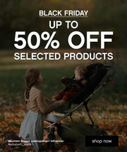 BLACK FRIDAY 2024 - up to 50% OFF selected parenting products - school age child kneels in front of 4 wheel kids pram interacting with toddler - Mountain Buggy cosmopolitan influencer @elizabeth__stahn - shop now