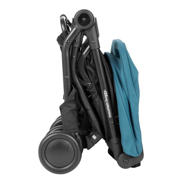 mountain buggy nano travel buggy in colour teal showing compact fold from the side_teal