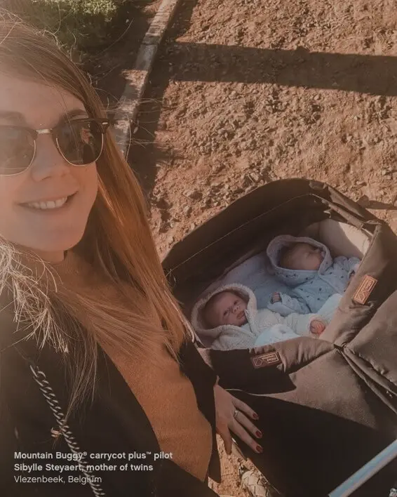 Infant twins keep warm while relaxing in their twin carrycot plus on a duet™ double stroller - Mountain Buggy