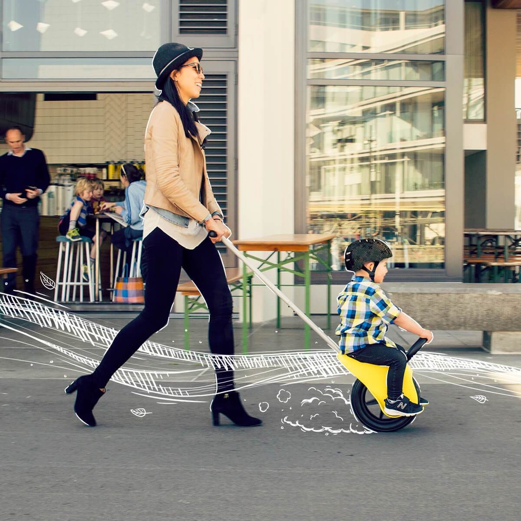 Mountain Buggy unirider with mum pushing her son in the city_yellow