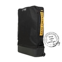 mountain buggy travel bag shown upright with gate checked label showing bag being taken to the plane door with KCCO logo_black